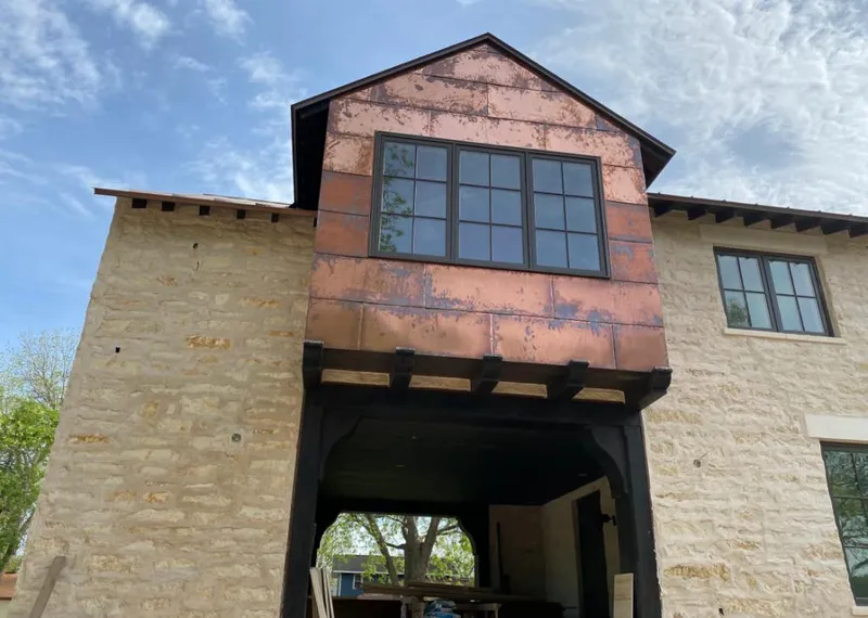 Copper metal panel facade on a stone building for Skylight Installation in Temecula